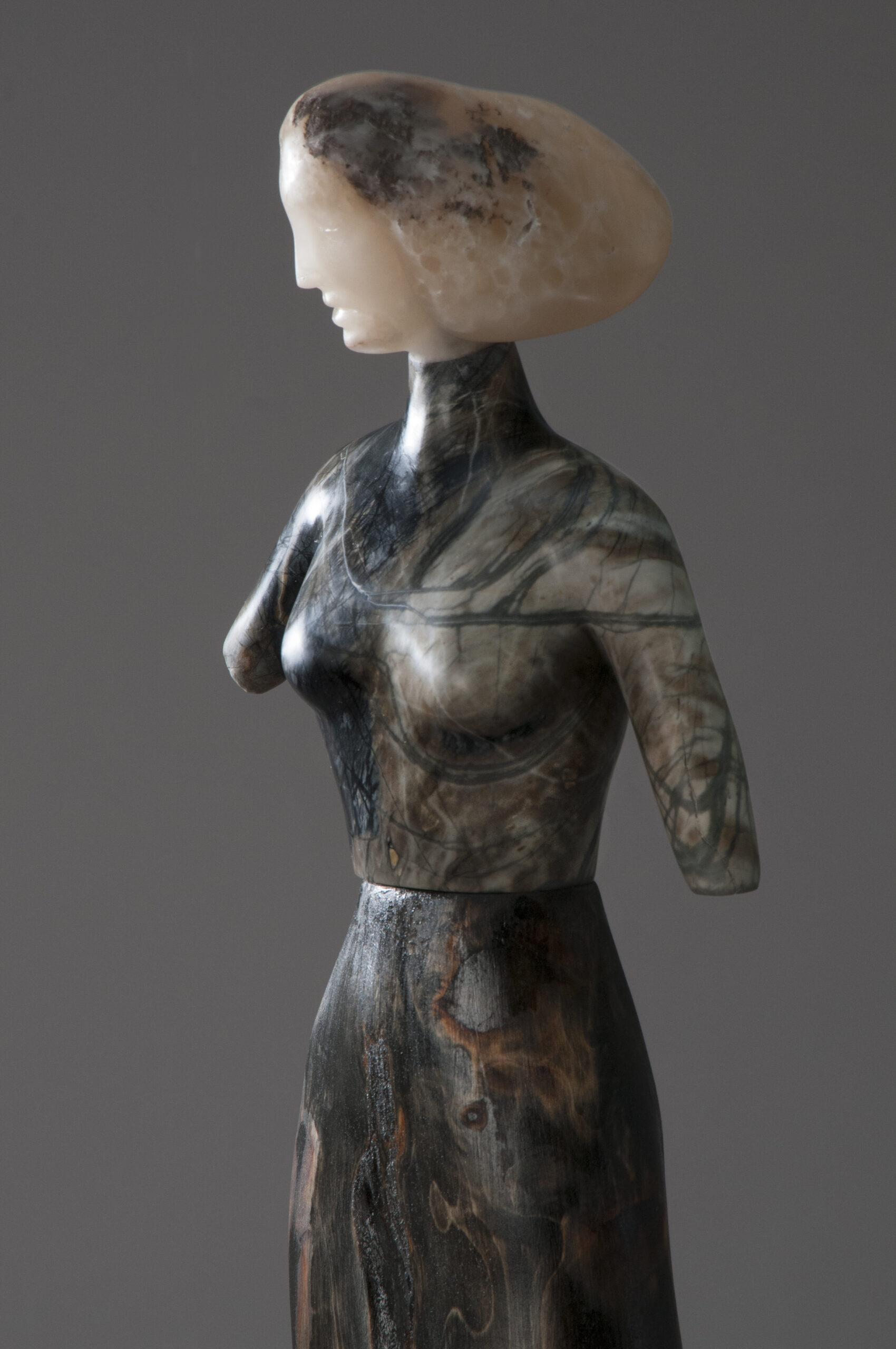 A sculpture of a woman with long hair.