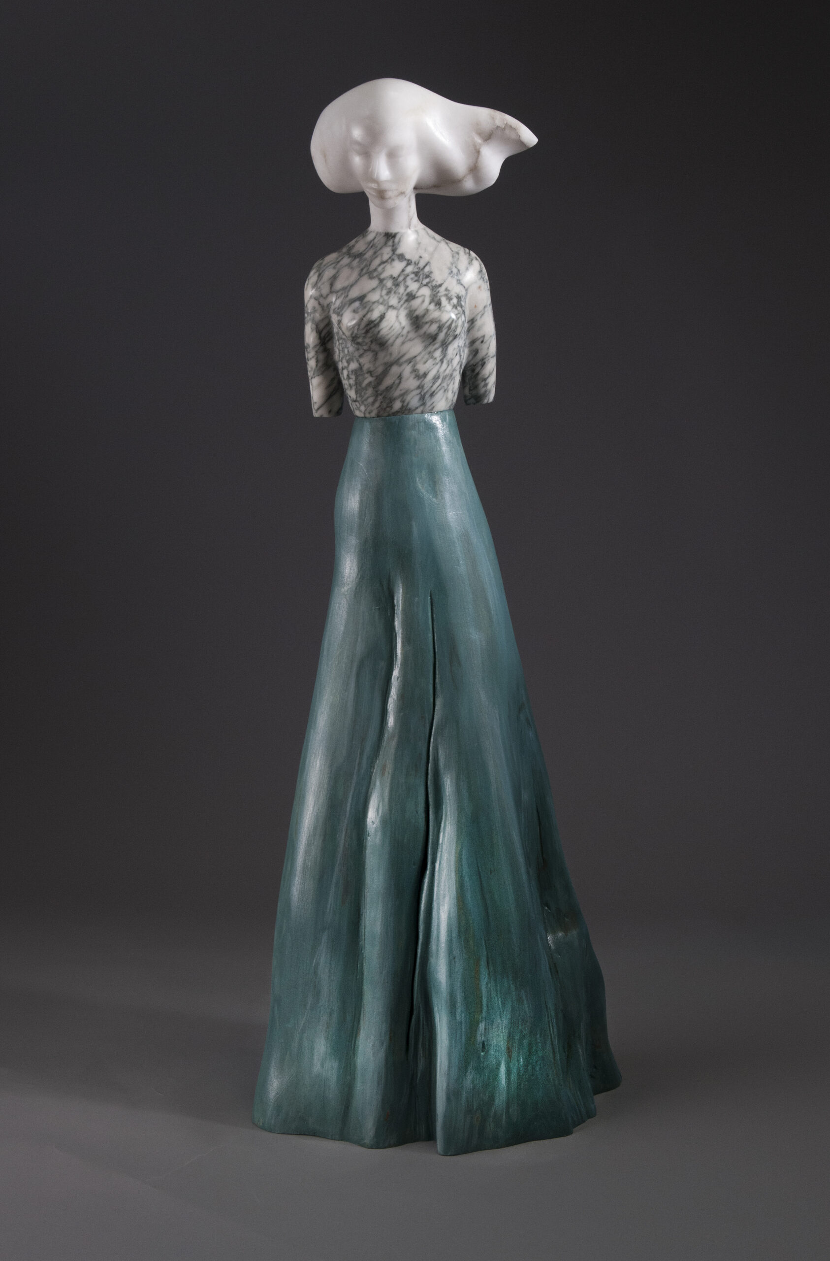 A statue of a woman in a long dress