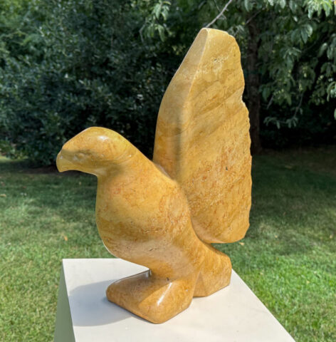 stone sculpture of a bird hawk