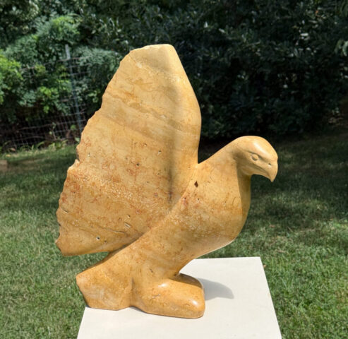 stone sculpture of a bird hawk